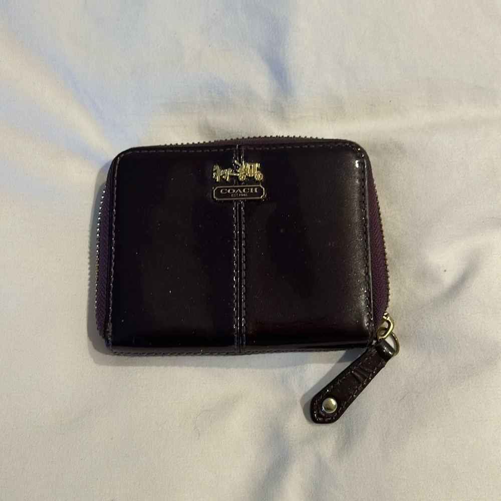 Coach wallet with zippered closure.two separate inside compartments